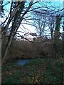 Boarded-up villa above the Shimna River