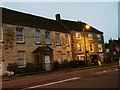 Dusk befalls shops on New Church Street Tetbury