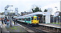 Electric multiple unit waits at Sutton Station