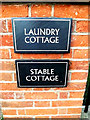 TM4489 : Laundry Cottage & Stable Cottage signs by Geographer