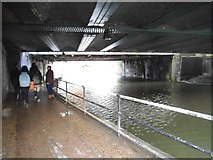 TQ2883 : Under the railway bridge on Regents Canal by David Howard