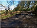 Signpost at road junction by Broadhanger Farm seen from the west