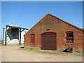 Silos and old brick barn at The Elms