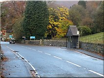 NY3406 : Bus stop on the A595 by Graham Robson