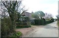 Footpath junction with road close to  Higgs Farm near Pope