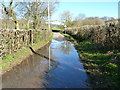 Legacy of recent flooding on the road to Glyn