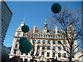  : View of the Pilot Network building covered in green balloons from the St Patrick's Day parade by Robert Lamb