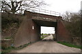 Disused railway bridge over the track to Haughton Hall Farm