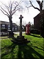 Ancient cross and telephone box