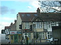 Bud Flavour Caribbean takeaway and adjacent houses, Manor Road, Merton