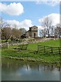 Across the village pond to St Peter