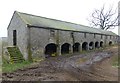NT9904 : Fine farm buildings with stone arches by Russel Wills