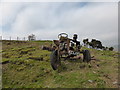SH8204 : Old tractor skeleton beside Glyndwr's Way above Glantwymyn by Jeremy Bolwell