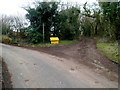 Yellow grit bin at a junction, Five Lanes, Monmouthshire