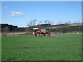 NT9733 : Crop sprayer at East Fenton by Graham Robson