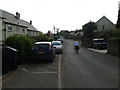 Houses and cyclist in Stogumber