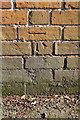Benchmark on wall on SE side of Peppard Road