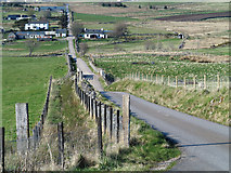 NC5905 : Road descending to pass Balloan by Trevor Littlewood