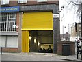 TQ3082 : Behind the yellow door: where Boris bikes spend the night, Belgrove Street WC1 by Robin Stott