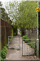 SU7682 : Looking south up the no-cycling passage by Trinity School by Roger A Smith