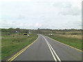 SS5790 : A4118 approaches the threshold of Runway 28 at Swansea Airport by Stuart Logan