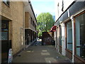 View of an alleyway beside Spitalfields Health Centre from Brick Lane