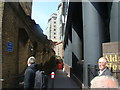 View of a passage between Aldgate House and tube station from Aldgate High Street