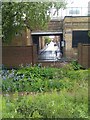 View over period garden and through railway arch