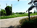 Bridleway from the west reaches road at Marlands