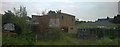 Backs of buildings and gardening plots, beside the railway south of Knights Hill Tunnel