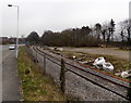 Single track railway line at the edge of  the Vale of Neath Retail Park, Neath