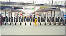 TQ3884 : Stratford: LUL Jubilee Line terminus, barriers 1999 by Ben Brooksbank