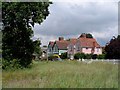 Matching pair of houses on the green, Hatfield Heath