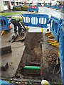 SP2965 : Shifting discarded cast iron gas main, Mercia Way, 4 June by Robin Stott