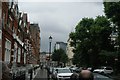 View of the Empress State Building behind the Earls Court Exhibition Centre from Earls Court Square