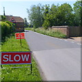 Slow - no road markings on High Street, Saul