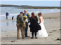 NU2424 : Wedding photography on the beach by Oliver Dixon