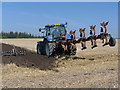 Ploughing the harvested field