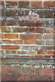 SU7566 : Benchmark on chimney breast of Chamberlains Farm house by Roger Templeman
