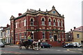 Horse taxi and library, intersection of Grasmere Road and Central Drive