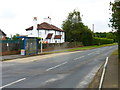 House and bus stop on south side of B380