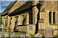 Church wall and gravestones, St Mary