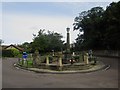 NU2410 : Roundabout and war memorial, Alnmouth by Graham Robson