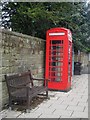 NU2410 : Telephone box and bench, Northumberland Street, Alnmouth by Graham Robson