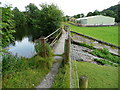 Footbridge over reservoir overflow channel