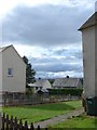 Looking between two houses in Alligan Road towards Kincardine Road