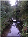 A weir upstream of the sunken footbridge