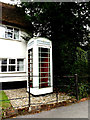 TM0335 : White Telephone Box by Geographer