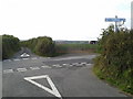 Lane junction with very new-looking signs on the signpost