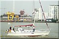 View of a yacht passing the Greenwich Peninsula